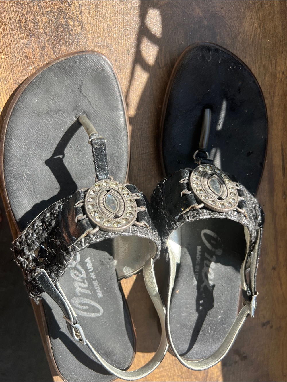 Onex Black Braided T-Strap Sandals with Decorative Medallions